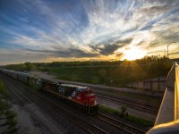 One of CN's latest acquisitions, a former Chicago & Northwestern GE C40-8, leads train 434 into Aldershot Yard under a dramatic sky.