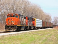 CN 439 thunders Westward with a pair of distinctly Canadian GP38-2W's at a good pace and breaking the silence in the quiet hamlet of Jeanette's Creek.