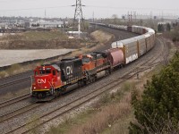 CN 711 works off the main at Oshawa with a nice set of power. This train tends to replace 570's Oshawa and 571's Belleville traffic, making lifts at both locations. 

Get your shots from this location while you can, as it won't be available for too much longer; the road will eventually be closed due to the progress of GO Transit's Whitby Maintenance Facility.