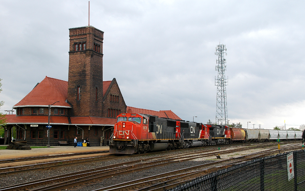 Detour train 316 rolling past the Brantford station behind CN 5606 - CN 5463 - CN 2613 and 121 cars