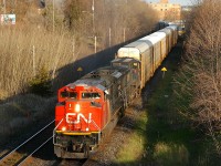 CN 8807 - BCOL 4654 charge up the grade to Hardy with 134 cars behind the power