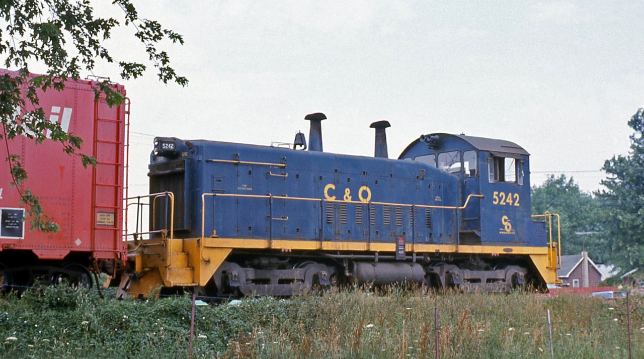 Chesapeake and Ohio SW9 5242 works Chatham ON in August 1974. Another Canadian-built unit, it was built by GMD London for the C&O as their 5242 (S/N A151, blt 2/1951), part of a group of 5 units (5240-5244). This unit went on to serve on the Port Stanley Terminal RR as their L3 in 1985, and later went to OSR to become their 52 (currently stored out of service).

(Geotagged location not exact).