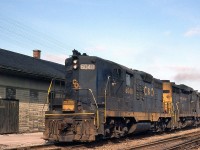 A westbound Chesapeake and Ohio freight with GP9 6048 leading a 3000-series C&O GP30 heads past the old CASO (NYC/PC/CR) Depot on the Conrail CASO Sub at Hagersville ON, almost a year after Conrail was formed.
<br><br>
While the line may have been removed, the Hagersville Depot (or station) survives in use by Southern Ontario Railway, whose line (as the CN/GTR) once crossed the CASO at a diamond just west of the station.