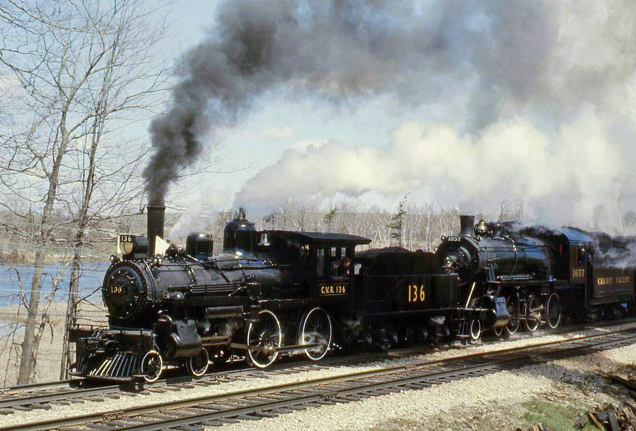 Numerous fantrips were run in the 1970's with the "Credit Valley Railway" 136 and 1057, the famed former CPR 4-4-0 and 4-6-0 (D10) that went onto hauling excursions after the end of steam. On one such run under the Ontario Rail Association, CVR 136 and 1057 haul their train past Campbellville Ontario on the CP's Galt Sub in 1974, with a nice head of steam.

Today, both enjoy a post-retirement career on the South Simcoe Railway, hauling tourists in vintage heavyweight passenger cars along the former CN Beeton Sub out of Tottenham ON.
