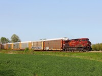 A lone GE AC4400CW leads a solid consist of autoracks into Chatham as CP 147