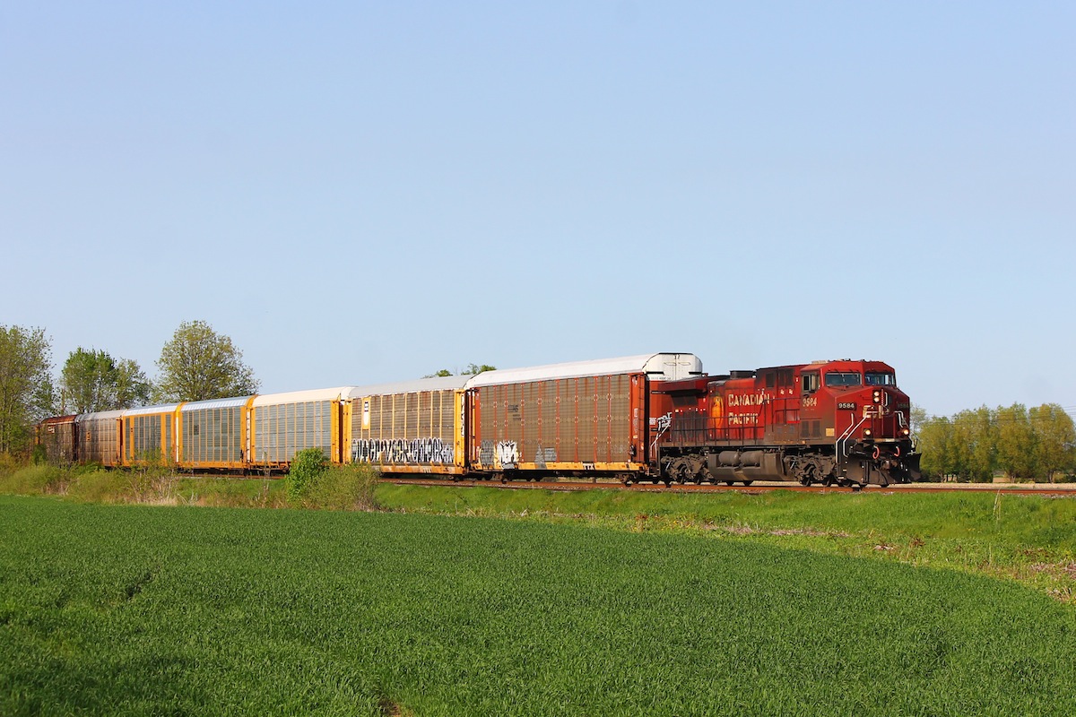 A lone GE AC4400CW leads a solid consist of autoracks into Chatham as CP 147