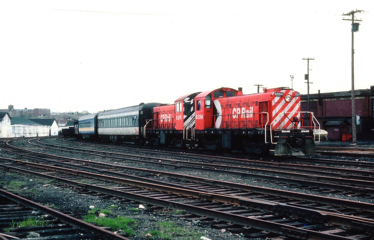 Built back in 1957, a couple of MLW S-3 switchers are still at work in Sudbury in 1981 moving around a couple of VIA coaches. Unfortunately it was a real dull afternoon when this image of CP 6594 and 6576 was captured. I have forgotten just what this move was all about, and even forget the exact location in downtown Sudbury. Perhaps one of this group familiar with Northern Operations can help out?