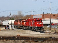 CP 235's power has cut off their train on the main and backed down the back lead to set off two GP20ECO's at the shop track. The train was recrewed here -  note the new crew pulling up in a limo! There are significant changes being made at the yard here including clean up at the east end of the yard, a new MOW storage area at the west end, brush cleanup and new switches to be installed. Power into town was CP 5926-5919-2211-2266. Geoff Elliot also caught this train west of London at Belle River.  