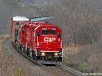 CP 3103 and 3027 lead 8642, T25's train and then 609's train at Port Hope (you can see the mileboard through the trees above 3103). This is a rescue; the 8642 experienced technical difficulties and a 608 had to lend a hand to shove 609 back to Port Hope. T25, the Trenton Turn (aka the Cobourg Tun, aka the 'Turd'), has added its cars to 609 and is now beginning the climb up to Newtonville after letting 142 and 608 by them. 1424hrs.