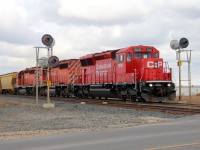 One of CP's new SD30C-ECOs and a pair of SD40-2s split the signals at Marquette.