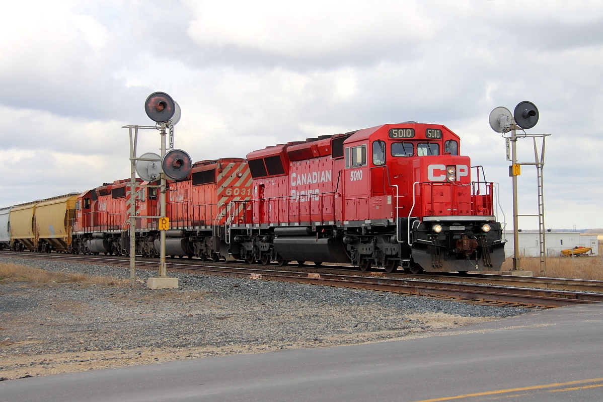 One of CP's new SD30C-ECOs and a pair of SD40-2s split the signals at Marquette.