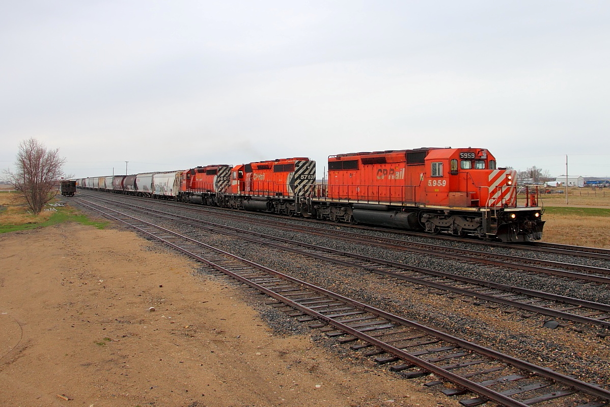 A trio of SD40-2s lead grain loads through Marquette.