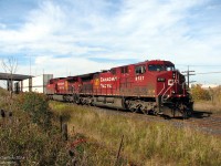 CP 104 with a pair of golden rodent-bearing GE AC4400CW's on the head end, CP 9737 & 8554, sits at the south siding switch at Bolton ("Begin/end CTC sign Bolton, B-O-L"), awaiting the light to head south to CP's Vaughan Intermodal Terminal to deliver their train of cross-country intermodal containers (and then subsequently head to Toronto Yard light power). Highway 50 / Queen Street sits in the background on a sunny afternoon.