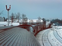 In March 1967 I rode the Atlantic Limited from Montreal to St. John. A skyline car served as diner lounge. The consist was a mix of stainless steel and heavyweight cars. I remember a really good dinner in the skyline the night before. The next morning, most likely after a good breakfast, I wandered into the dome and snapped this picture at (I believe) Fredericton Jct.