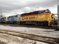 CSX power sits outside the shop at Sarnia ON. Here we have three different paint schemes coupled together: CSXT GP38 2003 wearing the pre-CSX era "Chessie" livery, behind is the original two-tone blue CSX livery on 2013, and another sister 2000-series unit sporting the modified livery with yellow ends that became standard.