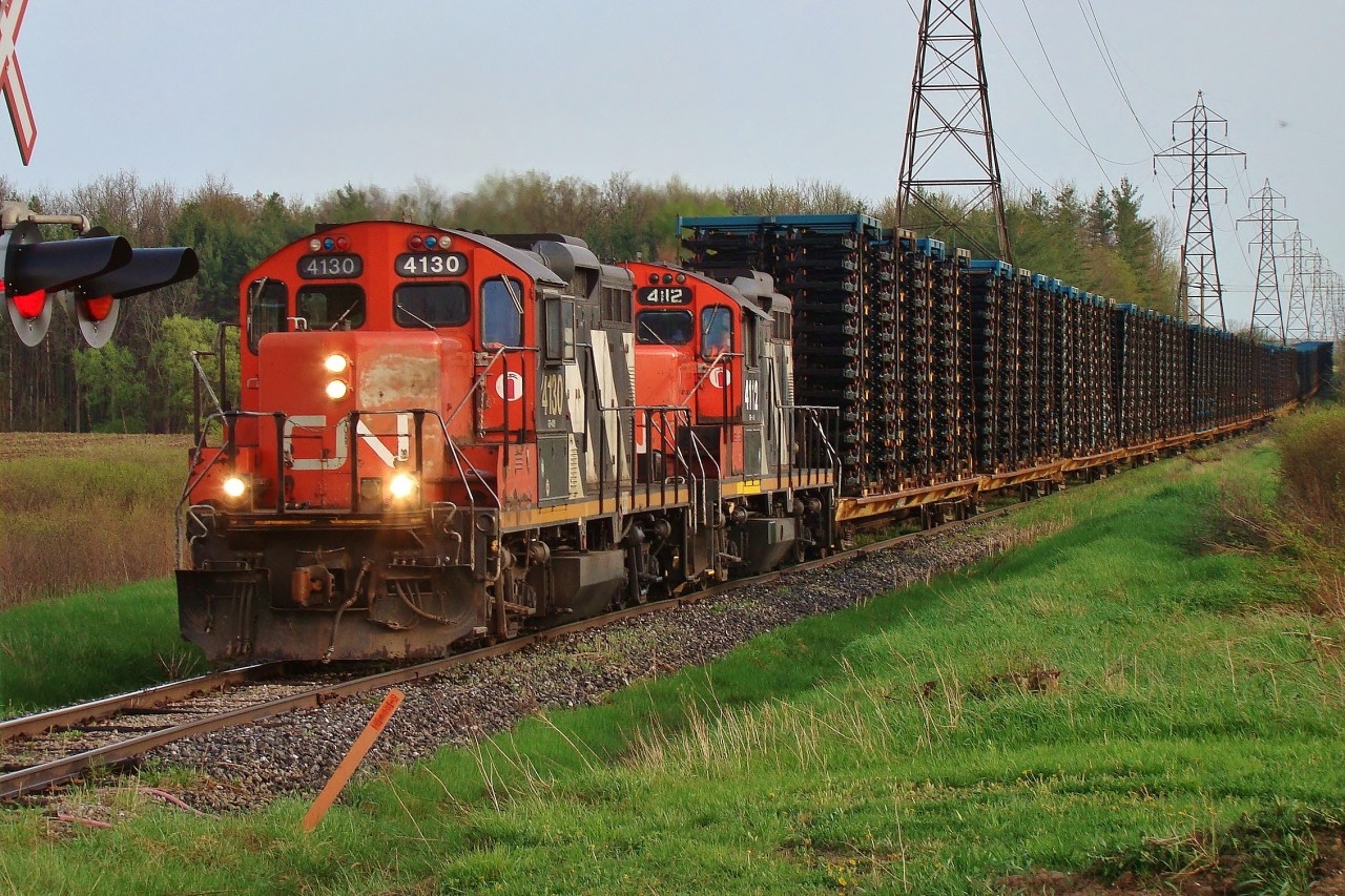 Two ancient GP9's head towards London after spending the afternoon switching in St. Thomas. The train is made up of mostly frames from Formet with the exception of 1 tank car near the end of the train.