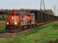 Two ancient GP9's head towards London after spending the afternoon switching in St. Thomas. The train is made up of mostly frames from Formet with the exception of 1 tank car near the end of the train.