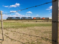 CN's daily Calgary-Edmonton manifest rumbles north through Irricana with an awesome consist of 8101, 8102, 5250 and 7707.