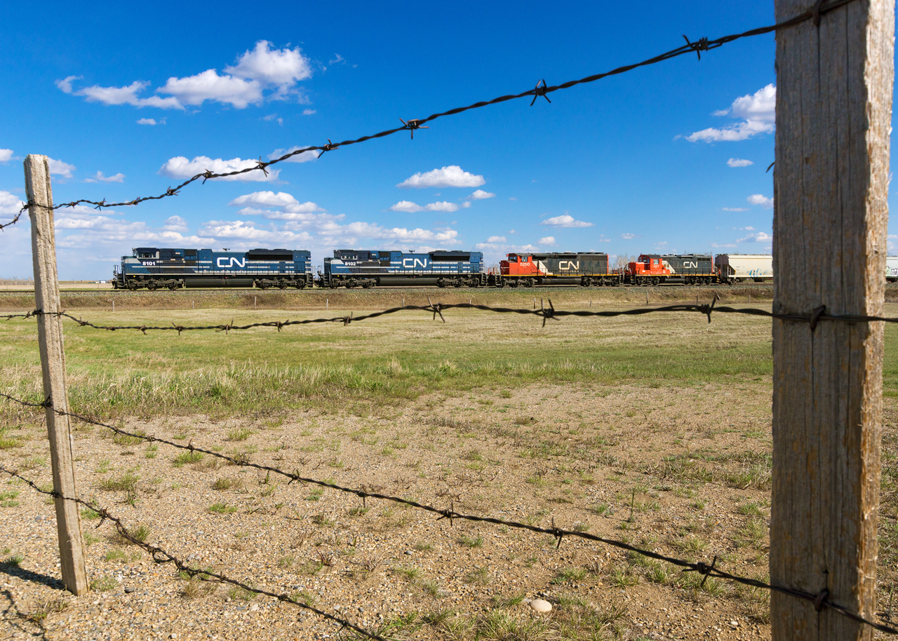 CN's daily Calgary-Edmonton manifest rumbles north through Irricana with an awesome consist of 8101, 8102, 5250 and 7707.