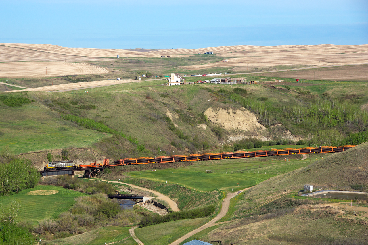 Funeral train... CN 921 rumbles west along the Drumheller subdivision with one of many loads of rails to be pulled in the coming weeks between Hanna and Lyalta. The scenic rail line through the Alberta Badlands will soon be history.