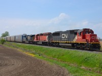 CP 240 led by CN 5438, CP 5749 and CSXT 567 heads east out of Belle River on its way to Tilbury where it will meet a 609 waiting in the siding.