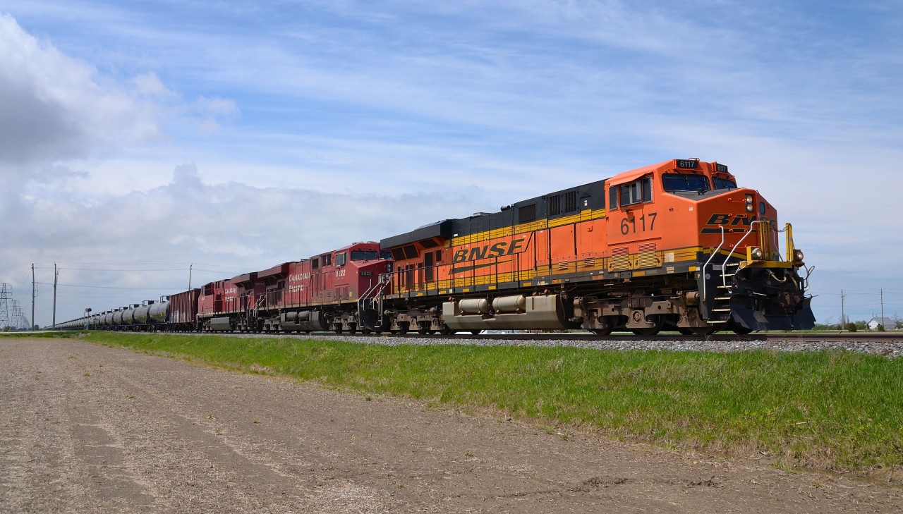 CP 608 led by BNSF 6117 passes eastbound thru Haycroft headed for Tilbury where it would meet CP 235