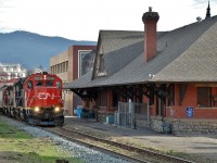 CN(WC) 3027 is in charge of the northbound local freight as it passes Vernon's old CPR station (1911).