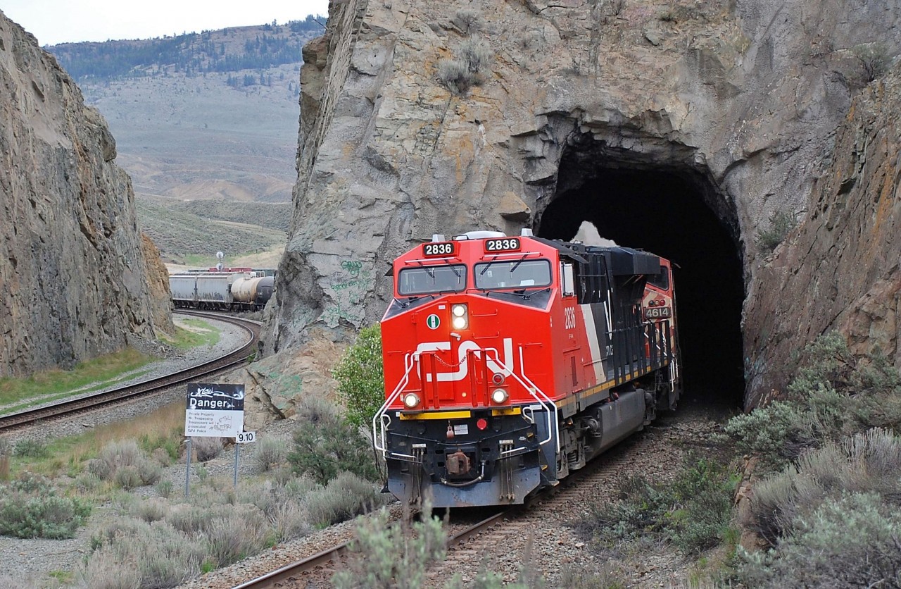 CN 2836 & BCOL 4614 emerge from the tunnel @Kissick and are heading westward in charge of a mixed freight on the Ashcroft sub.