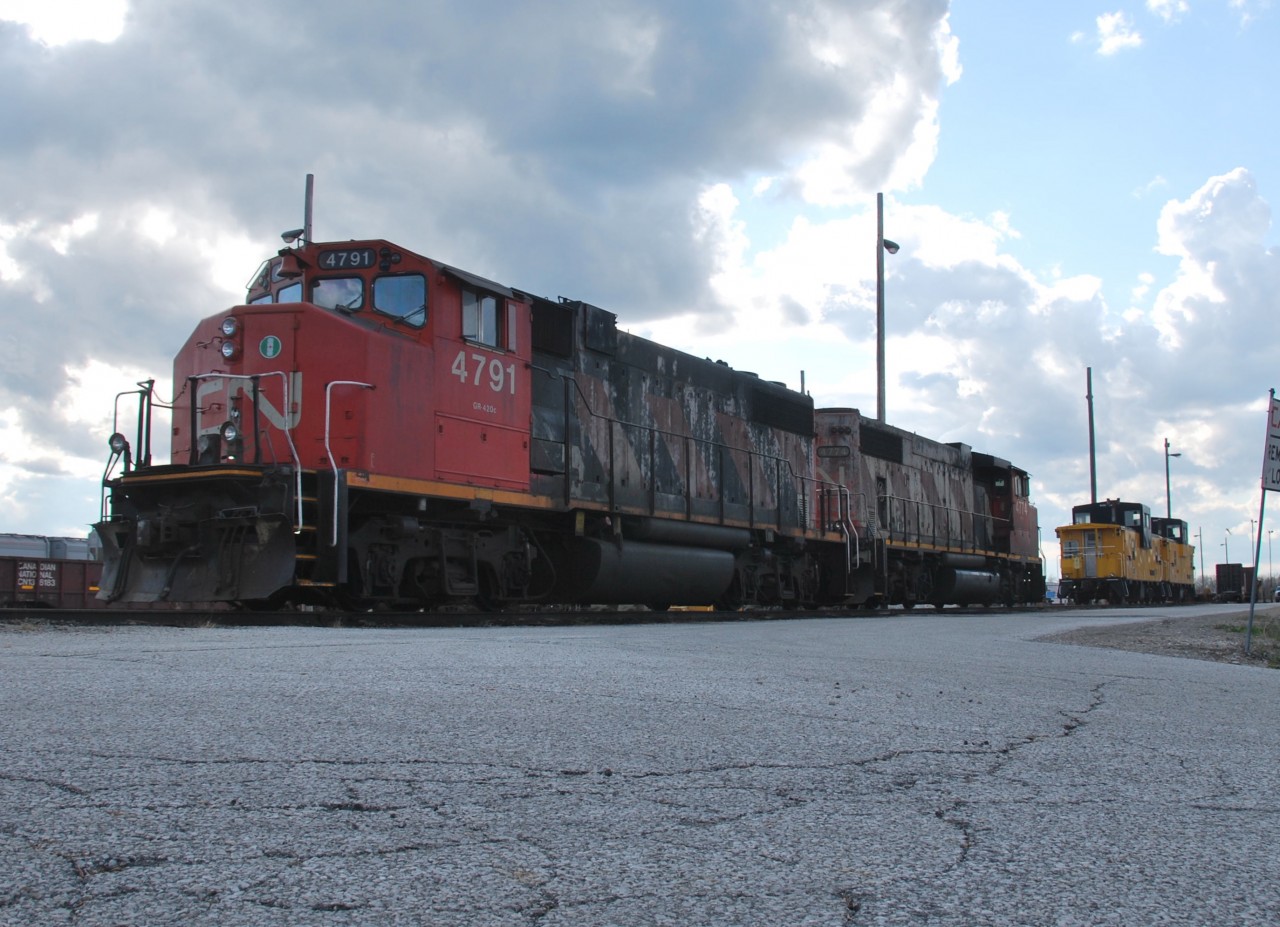 CN 4791 and CN 4774 are shut down for the night and getting ready for yet another early morning dragging 438 to London while WCRX 1040 and 1042 sit on the engine track awaiting their fait to go out on 438 sometime this month.