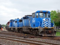 After finding out yesterday that SOR is getting two SD40us to replace their four leased GP20Ds, I figured I had already photographed GP20Ds on the SOR for the last time... not so. They were running very late today, and made a daylight appearance in Brantford. CEFX 2019, CEFX 2015 and RLK 4057 are seen pulling their first cut of cars out of the yard. There is only one known fan of GP20Ds in the railfan community, and he stood beside to witness the beginning of the end. His sobbing was a bit much.