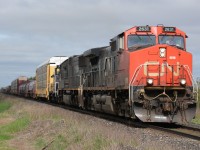 CN2631 heads east at Fairweather Line with IC1034 and ferrying CANDO Ltd. CCGX1008 after having work done at Lambton Diesel in Sarnia.