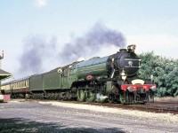 Another image from The Flying Scottsman's visit to Canada in 1970: with the crew hanging out of the cab and railfans under the station awning, LNER 4472 is seen speeding past Jordan Station on a runby along the CN Grimsby Sub, before later being on display at <a href="http://www.railpictures.ca/?attachment_id=14859"><b>Niagara Falls Station</b></a>.