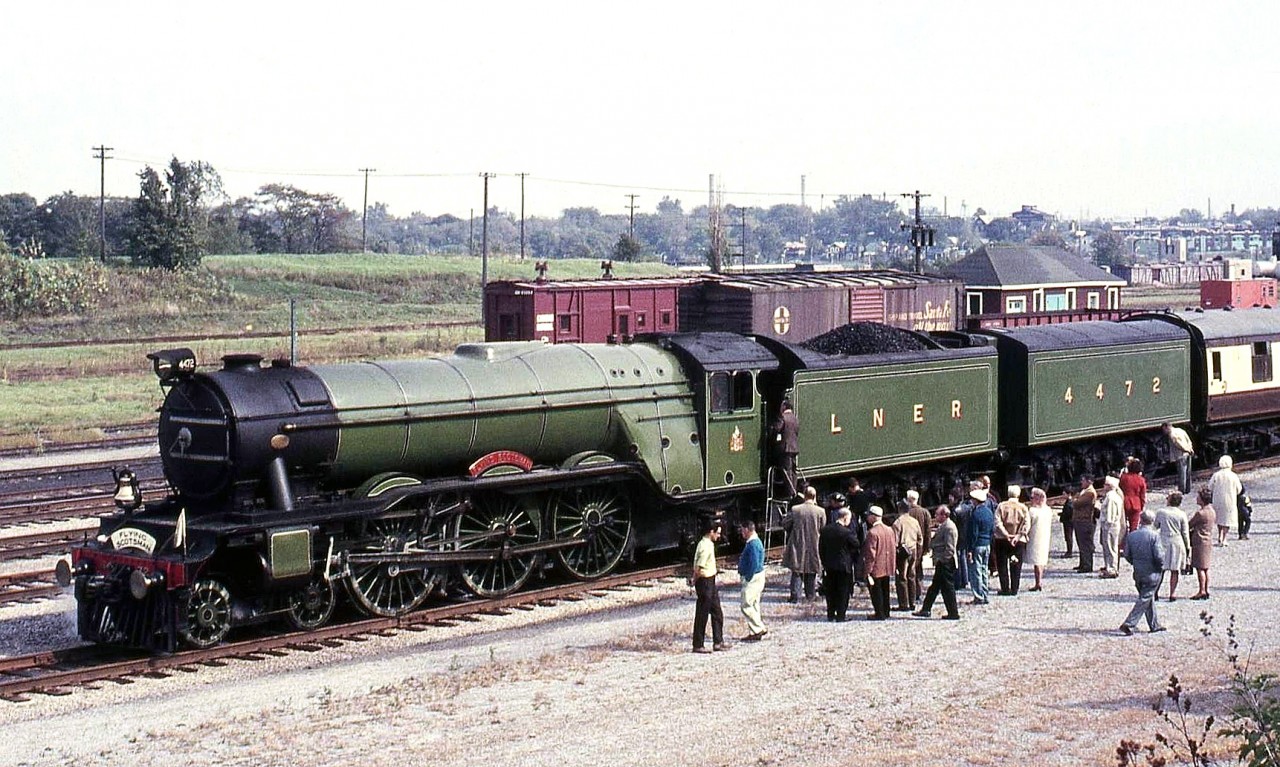 Sitting near the CN station in Niagara Falls ON, is restored LNER 4472, the famed "The Flying Scotsman", operating in Canada as part of its North American visit in the early 70's. Passengers and other bystanders get to examine the cab and controls via a set of steps placed by the locomotive's cab.  And a month or so earlier, rolling through Bayview Junction: http://www.railpictures.ca/?attachment_id=15247
