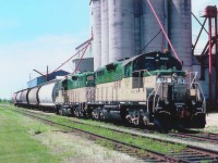 The fledgling GEXR had only been operating a scant two months when this photo was taken in June of 1992. The start-up power stable consisted of units 177-178-179 and 180. Here we see 179 leading 180; en route to Stratford from Goderich after working its way along the line. The train is picking up on the Thompson Feed siding. Thompson is renown for its birdseed among other things.