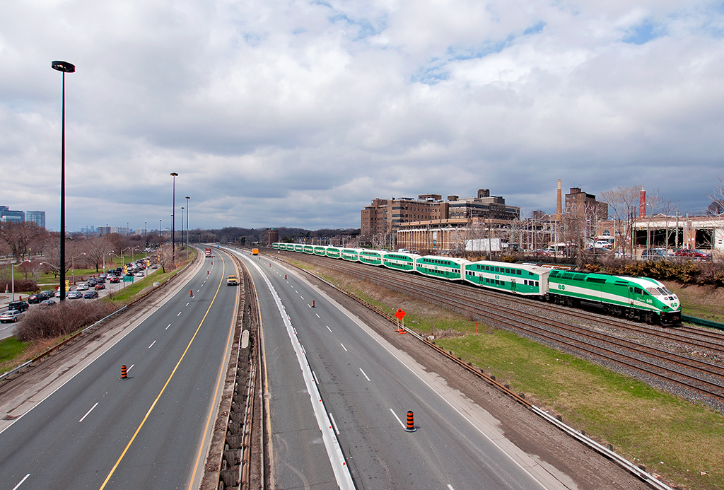 With the Gardner Expressway shut down every year for spring maintenance, Toronto becomes a traffic headache with drivers trying to make there way around the chaos. GO 646 shoves a westbound past a rather empty expressway on this cold spring afternoon.