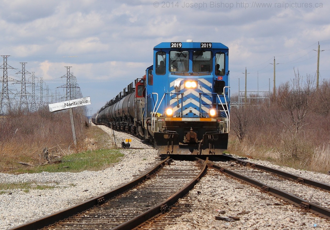 SOR 595 eases past the CN Nanticoke sign as they head for the yard to drop off cars that will be moved to Imperial Oil and US Steel in Nanticoke.  The power of 595 (CEFX 2019, CEFX 2015, RLK 4057) will drop their train and collect the cut of cars destined for Paris.  They will leave Nanticoke as SOR 597.