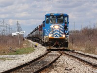 SOR 595 eases past the CN Nanticoke sign as they head for the yard to drop off cars that will be moved to Imperial Oil and US Steel in Nanticoke.  The power of 595 (CEFX 2019, CEFX 2015, RLK 4057) will drop their train and collect the cut of cars destined for Paris.  They will leave Nanticoke as SOR 597.