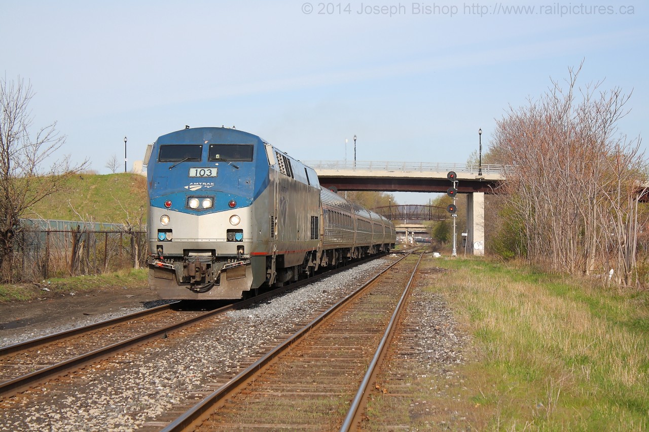 Via 97, the Maple Leaf approaches Wellington Street in Hamilton with Amtrak 103 on the point.