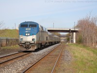 Via 97, the Maple Leaf approaches Wellington Street in Hamilton with Amtrak 103 on the point.