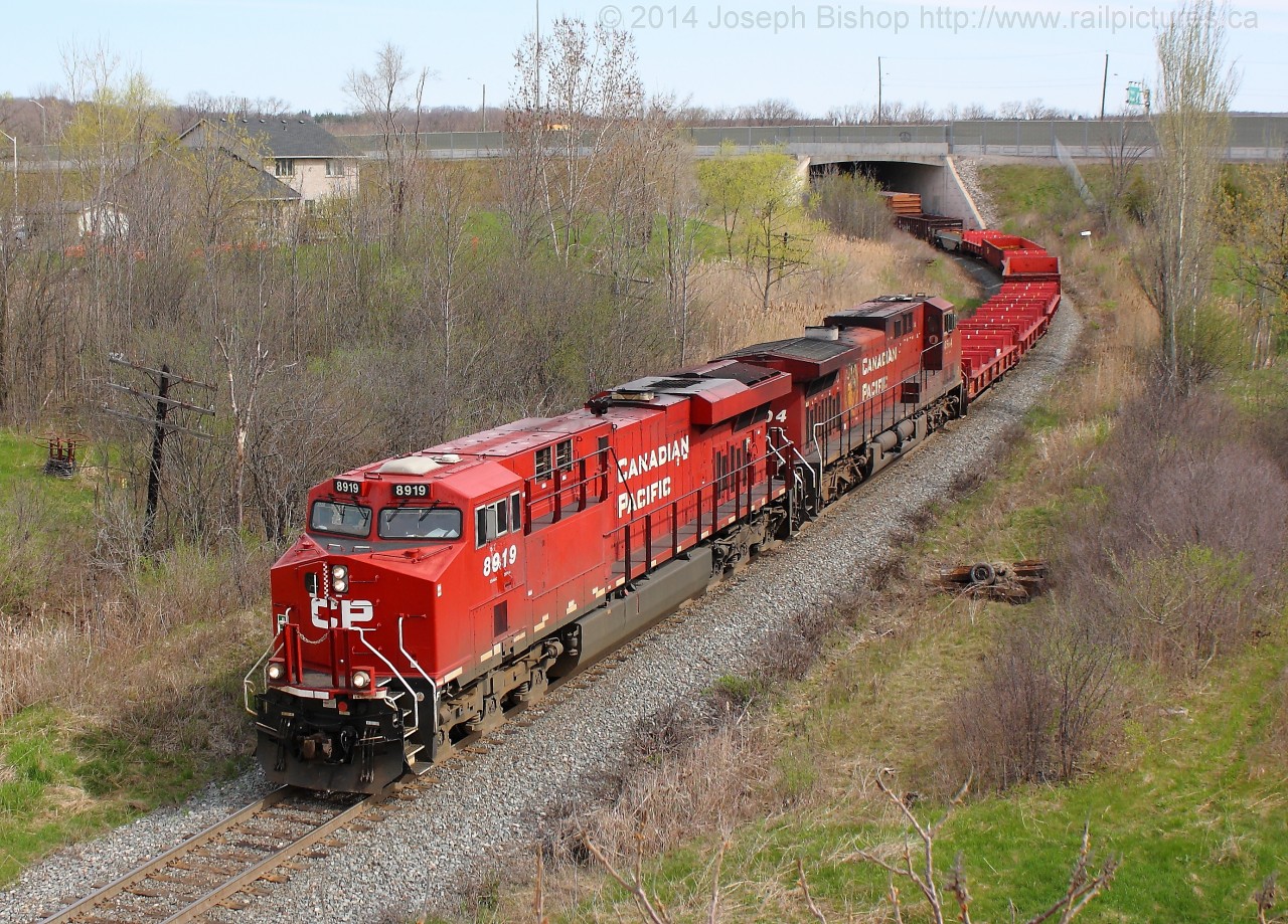 CP 246 glides through a curve on their way to Aberdeen yard in Hamilton with CP 8919 on the point of a very long and heavy train.