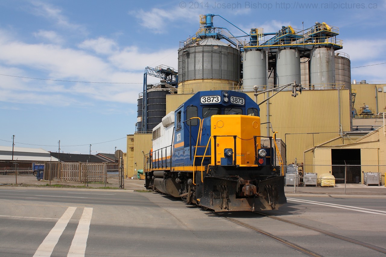 SOR 494 slowly backs across Burlington Street in Hamilton as they enter into the Bunge plant on the Hamilton Waterfront.  RLK 3873 will couple up to some cars on the pier and complete some switching around the plant before returning back to Stuart Street Yard.