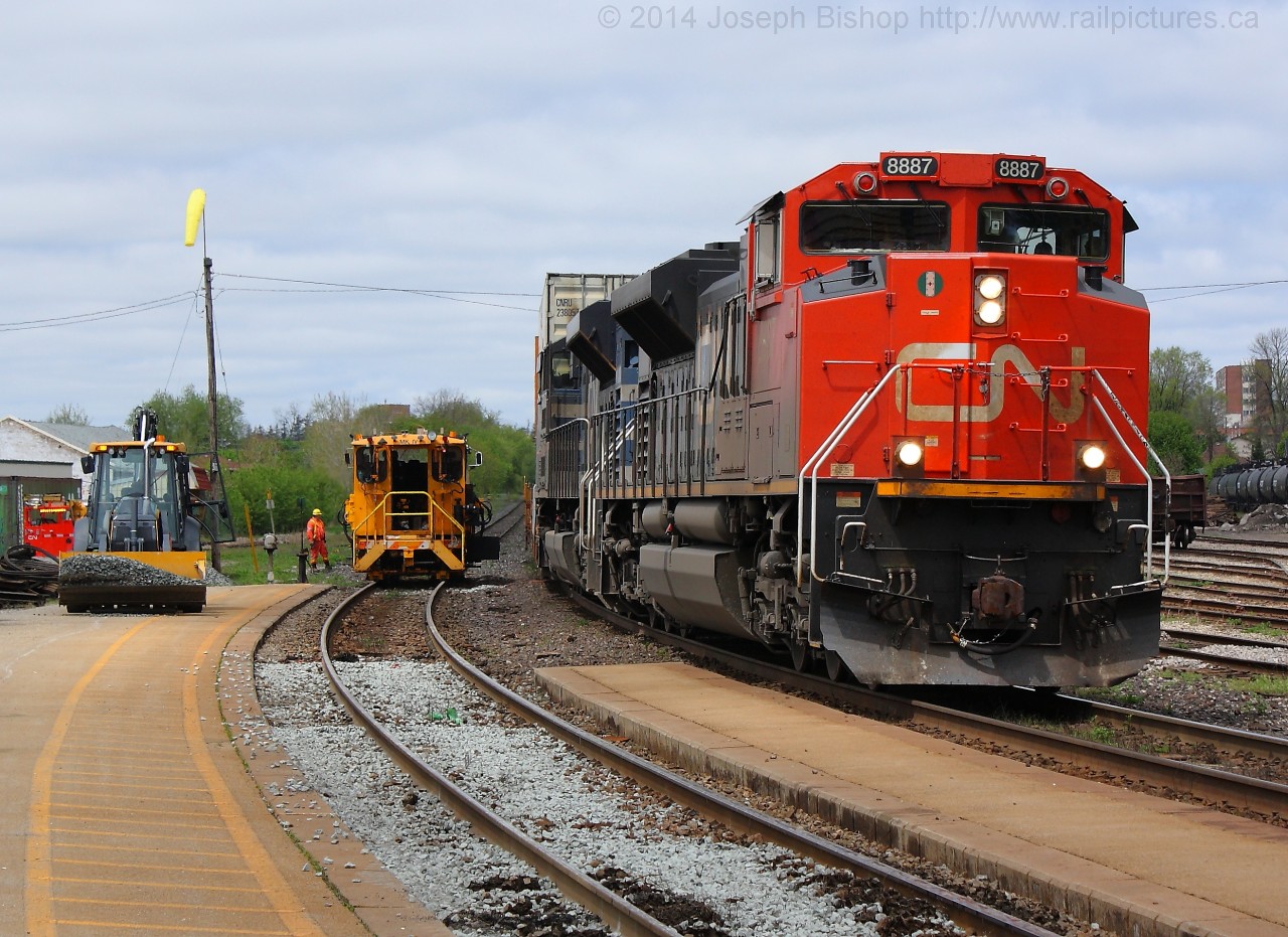 With tie replacement happening on the South track in Brantford, CN 148 was on the North today with CN 8887 and CN 8100.  At the point that this photo was taken, all the new ties were in place and workers were tamping the new ties and spreading new ballast to get the track ready for trains within the hour.
