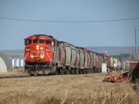  CN 852 with a single unit 5524 with 50 grain loads moving at track speed. #) miles
away is a new crew to take this train on to Winnipeg.