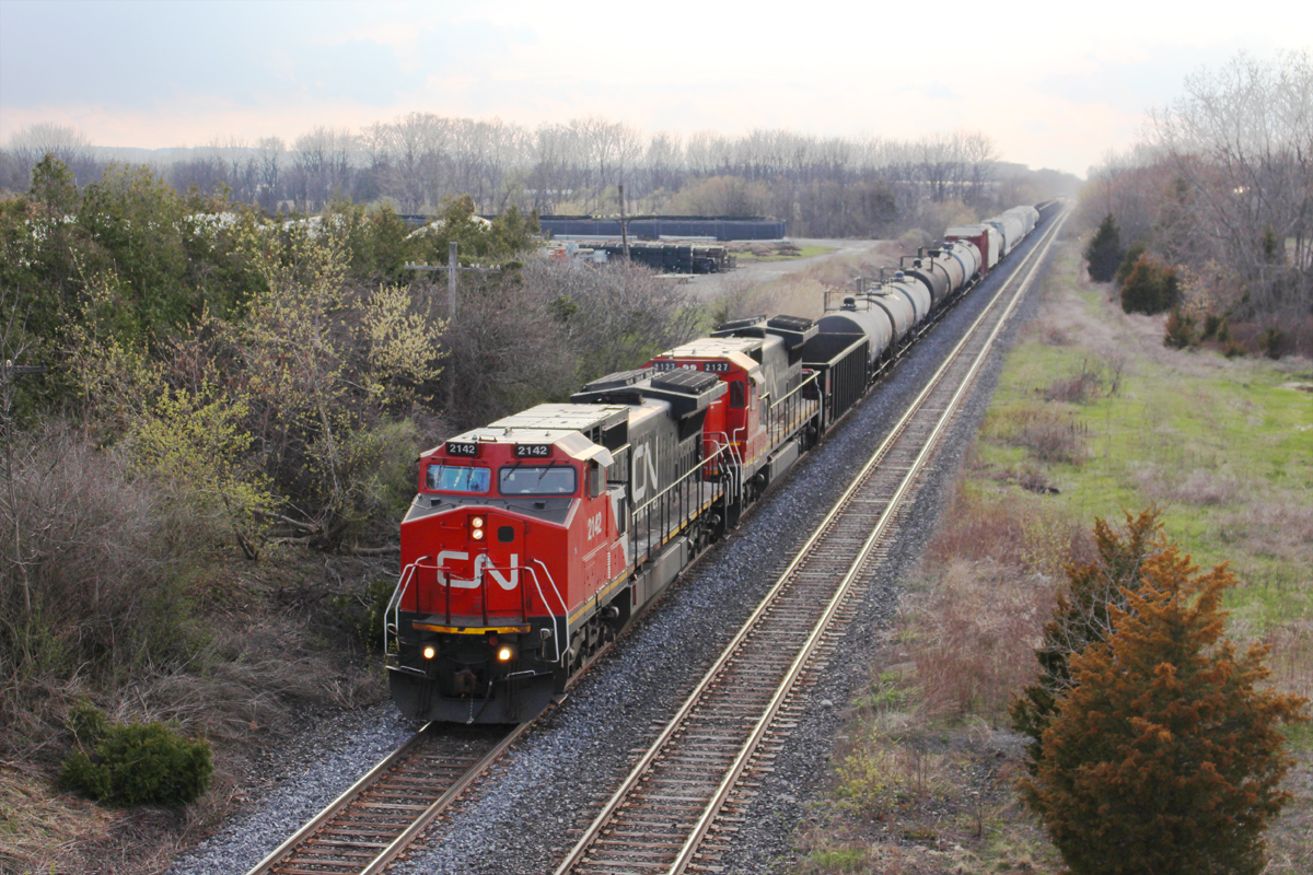CN 330 heads through the Jordan dip at 9th Street with a pair of Dash 8's. The sun and clouds have a battle for dominance, which creates some interesting lighting. From the crew's point of view, the skies are not very promising ahead.