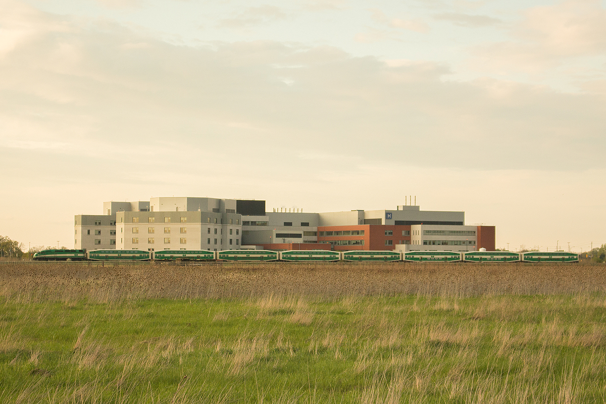The Toronto bound GO 788 passes the relatively new St. Catharines General Hospital on the outskirts of the city while on its way to Toronto.