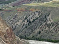 Southbound freight above the Fraser River, descending towards Lillooet, on the former B. C. Rail mainline.  