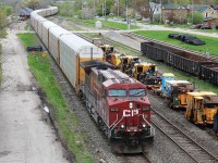 Galt yard as seen from Dundas Street overpass with 8600 hauling empty autoracks east. The yard plays host to rail maintenance equipment. The train can be seen snaking it's way over the Grand River bridge and past Galt station. 