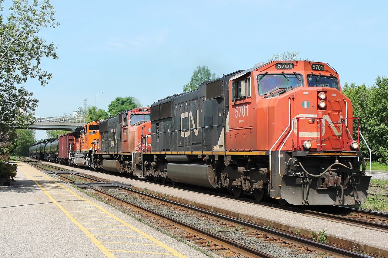 What a great day by 11:06 when my first ever sighting of a CN oil train, I had already seen two eastbound CN trains and one westbound CP from 9:30! This eastbound was highballing up the bank with CN 5701, CN 5681 and BNSF 9016 and a very long train. The two CN locos looked very "tatty" compared with the immaculate BNSF!