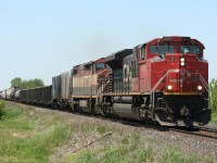 Just past the Sarnia city limits, CN 330 has just past the end of double track at Mandaumin as it heads east towards Hamilton and the Niagara peninsula with a BC Rail unit in the trailing position.

330's direct counterpart, 331, would also this day have another BC Rail unit in the consist, this time leading.