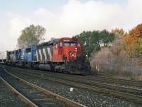CN5000 in pretty good shape leads 144 on semi nice fall day with a Conrail in the consist